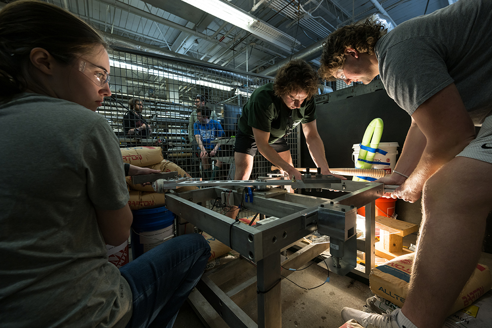Three students working on a project.